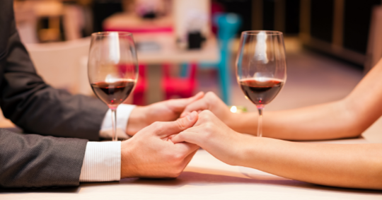 couple holding hands on a date