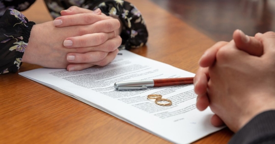 igning a divorce, marriage dissolution documents and agreement.
