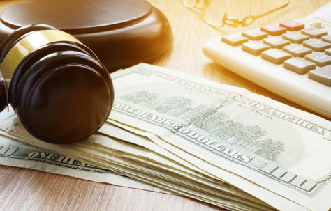 gavel, money, and calculator
